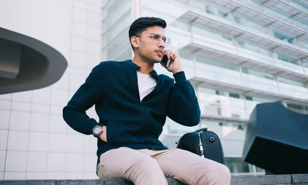 Concentrated Businessman Smart Casual Outfit Eyeglasses Talking Cellphone Sitting Parapet — Stock Photo, Image