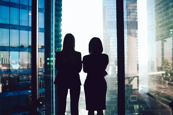 Back View Female Colleagues Formal Wear Standing Window Looking Modern — Stock Photo, Image