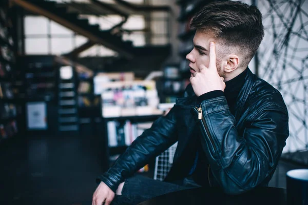 Side View Concentrated Young Male Black Leather Jacket Sitting Chair — Stock Photo, Image