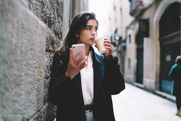 Young Female Trendy Coat Smartphone Hand Drinking Coffee Looking Away — Stock Photo, Image