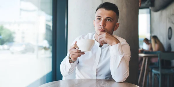Young Brooding Male White Shirt Pondering Looking Away While Sitting — Stock Photo, Image