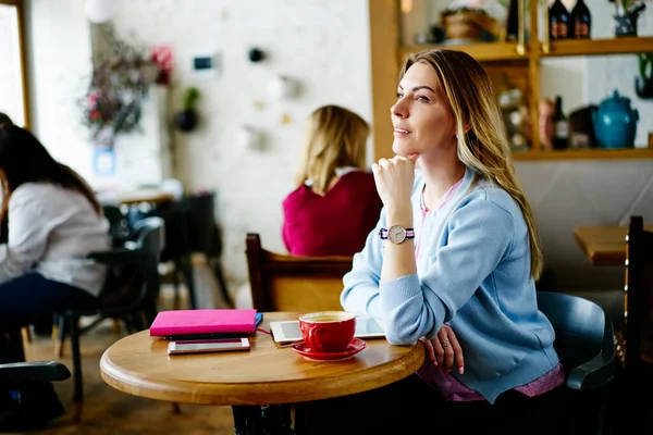 Side View Pensive Female Casual Clothes Sitting Wooden Table Drinking — Stock Photo, Image