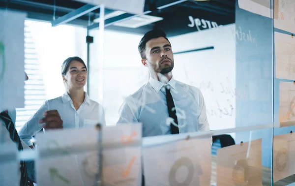 Successful Male Female Partners Analyzing Paper Reports Revenue Infographics Smiling — Stock Photo, Image