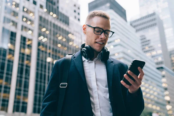 Smiling Elegant Handsome Young Man Glasses Trendy Coat Using Wireless — Stock Photo, Image