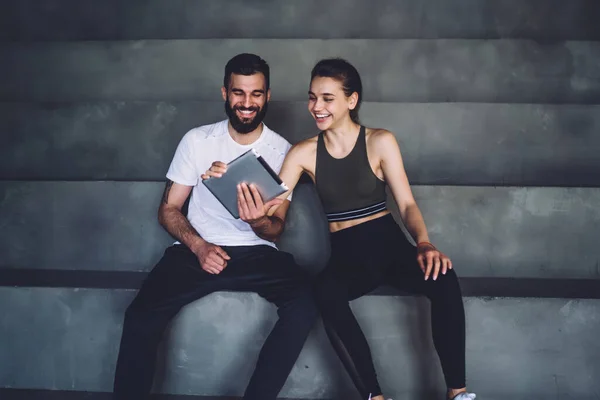 Cheerful Smiling Trainer Sportswoman Activewear Sitting Stairs Browsing Tablet While — Stock Photo, Image