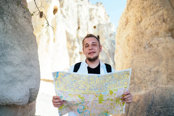 Glad Bearded Male Tourist Backpack Map Both Hands Looking Camera — Stock Photo, Image