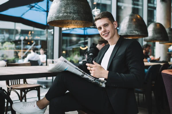 Low Angle Smiling Male Dark Suit White Sneakers Holding Laps — Stock Photo, Image