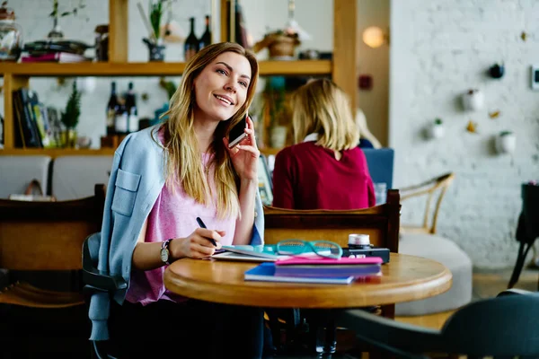 Happy Young Female Casual Clothes Smiling Looking Away While Sitting — Stock Photo, Image