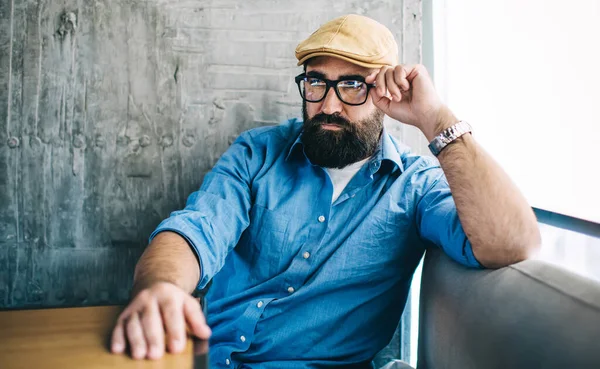 Middle Aged Hipster Guy Beard Eyeglasses Denim Shirt Cap Looking — Stock Photo, Image