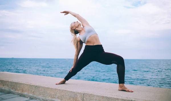 Young Blond Female Black Leggings White Top Standing Extended Side — Stock Photo, Image