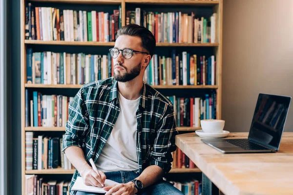 Pensive Black Haired Hipster Eyeglasses Taking Note While Sitting Cafe — Stock Photo, Image