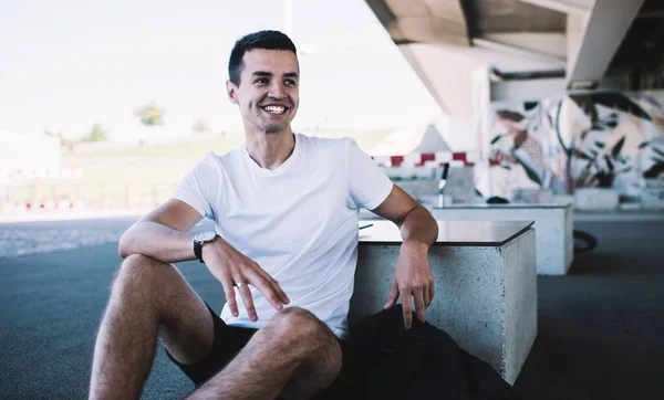 Happy Male Wearing White Shirt Black Shorts Smiling While Sitting — Stock Photo, Image