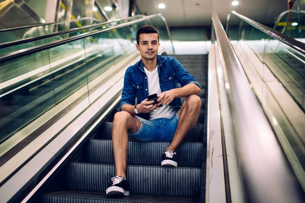 Positive Young Male Casual Denim Clothes Cellphone Wallet Hands Sitting — Stock Photo, Image