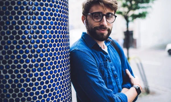 Smiling Young Man Casual Clothes Earbuds Looking Camera Standing Crossed — Stock Photo, Image