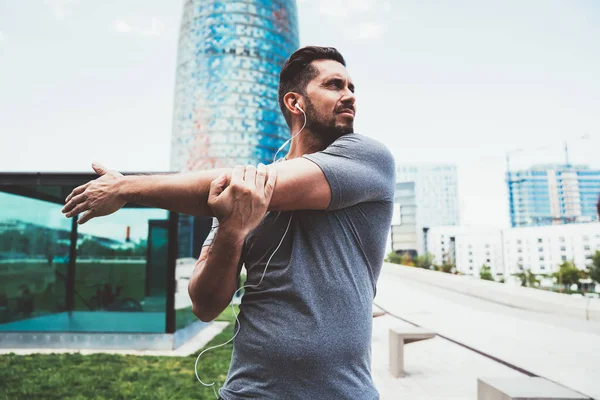 Muscular Caucasian Male Runner Active Wear Earphones Stretching Morning Workout — Stock Photo, Image