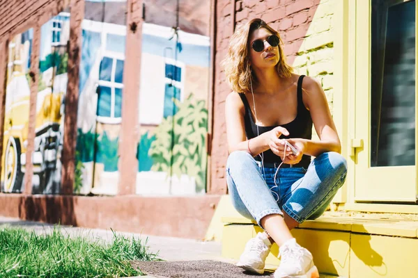 Young Woman Sunglasses Shirt Jeans Smartphone Hand Listening Music Headphones — Stock Photo, Image