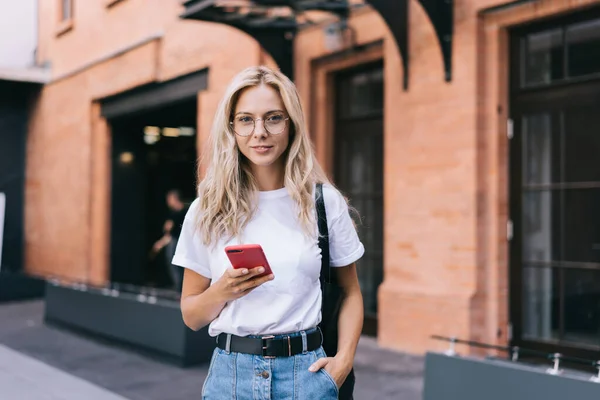 Happy Young Blond Female Casual Clothes Glasses Browsing Internet Smartphone — Stock Photo, Image