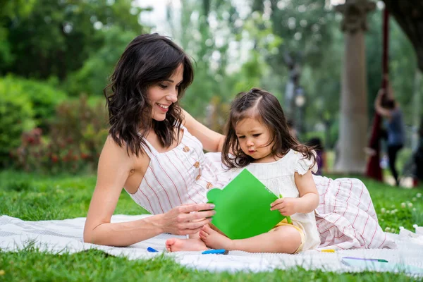 Amused Black Haired Lady Light Summer Wear Relaxing Grass Toddler — Stock Photo, Image