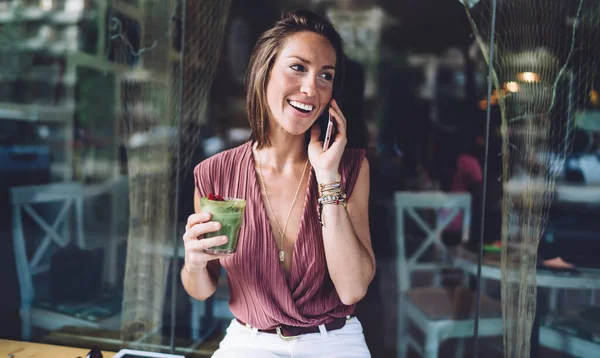 Joyful Ethnic Female Casual Wear Having Conversation Mobile Phone While — Stockfoto