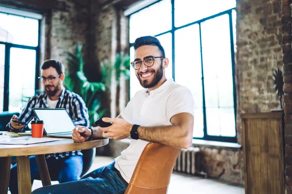 Positive Smiling Bearded Male Friends Sitting Table Smartphones Working Modern — Stock fotografie