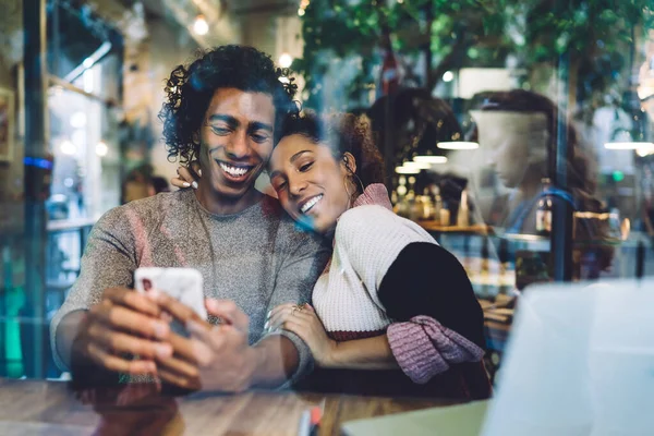 Glass Cheerful African American Couple Casual Clothes Sitting Wooden Table — Stock Photo, Image