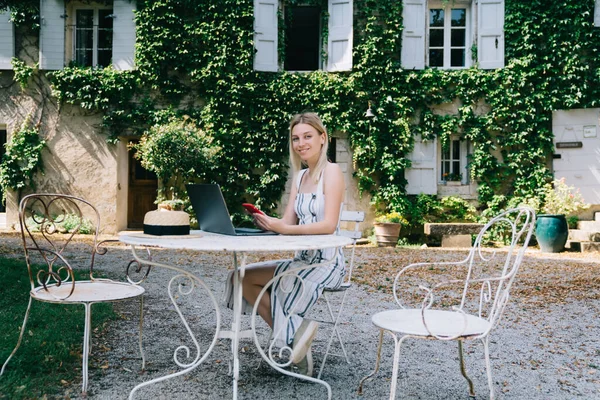 Full Body Young Female Remote Worker Sitting Table Computer Looking — Stockfoto