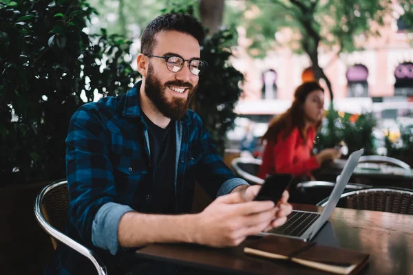 Happy Male Eyeglasses Casual Outfit Smiling Browsing Mobile Phone While — Stock Photo, Image