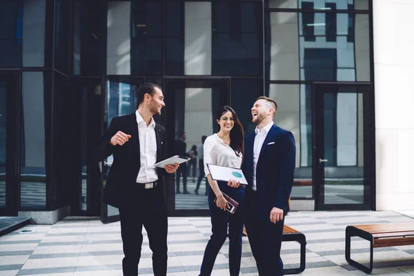 Smiling Laughing Young Coworkers Formal Clothes Standing Entrance Contemporary Glass — Stock Photo, Image