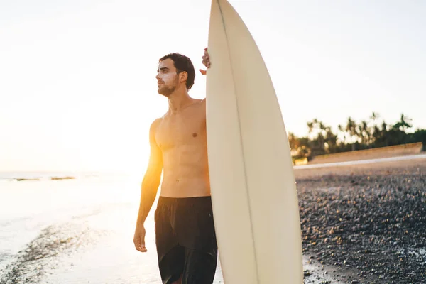 Young Shirtless Sportsman Sunscreen Face Standing Surfboard Shore Looking Away — Stock Photo, Image