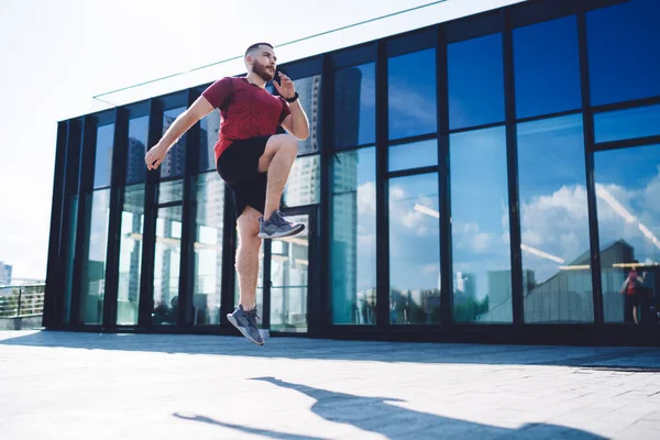 Full Body Young Man Sneakers Jumping Spot Training Looking Away — Stock Photo, Image