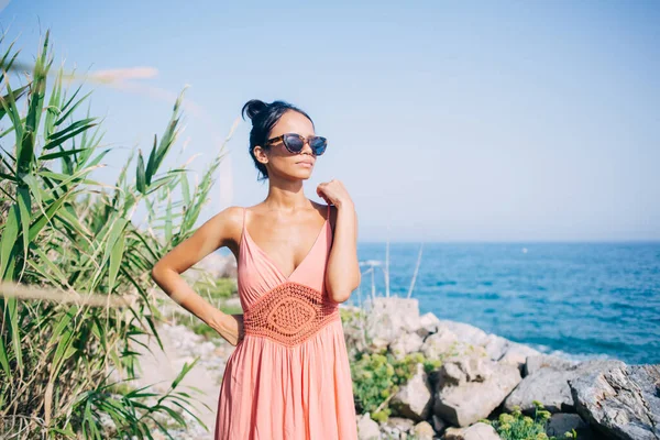 Charming Woman Glasses Sun Protection Standing Beach Seashore Thinking International — Stock Photo, Image