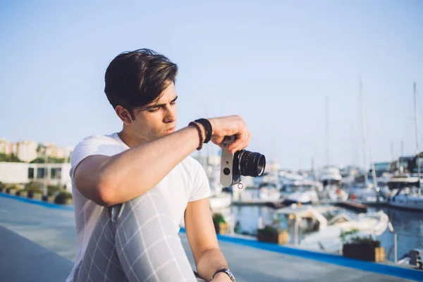 Pensive Caucasian Male Photographer Trendy Wear Sitting City Harbor Camera — Stock Photo, Image