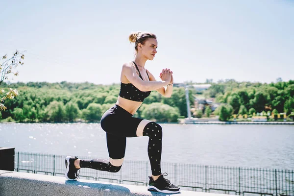 Energetic Active Woman Training Squatting Bending Leg Folding Hands Chest — Stock Photo, Image