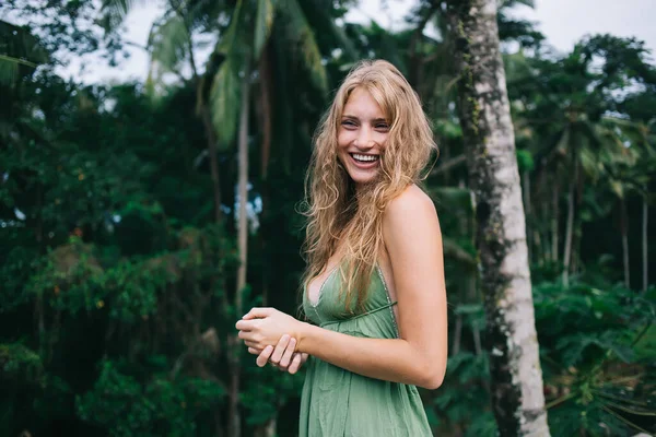 Joyful Natural Curly Haired Female Light Green Clothes Standing Bent — Stock Photo, Image