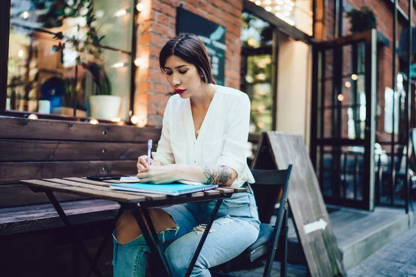 Concentrated Modern Young Lady White Shirt Ripped Jeans Making Note — Stock Photo, Image