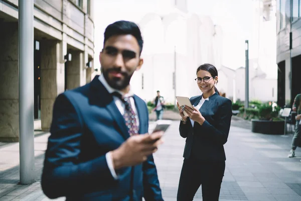 Content Glad Smart Multiethnic Coworkers Strict Formal Black Suits Browsing — Stock Photo, Image