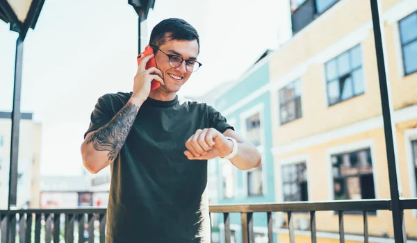 Slim Cheerful Tattooed Modern Man Checking Time Wrist Watches Ans — Stock Photo, Image