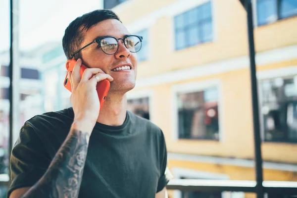Concept of generation and roaming connection for making international conversations via application on modern cellular gadget, Caucasian hipster guy in spectacles calling to operator for consultancy