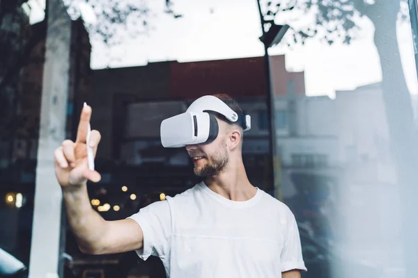 Cheerful Young Male Wearing Virtual Reality Glasses Enjoying Innovative Technologies — Stock Photo, Image