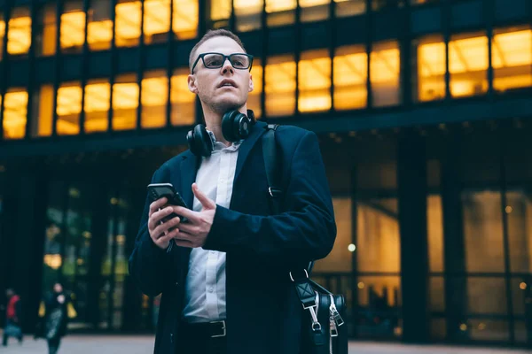 Contemporary Employee Coat Glasses Standing Street Work Smartphone Headphones While — Stock Photo, Image