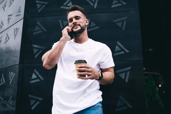 Smiling Bearded Male Casual Clothing Talking Smartphone Holding Disposable Coffee — Stock Photo, Image