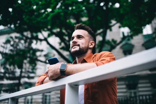 Smiling Hipster Handsome Man Beard Casual Orange Shirt Holding Smartphone — Stock Photo, Image
