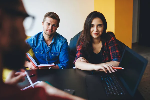 Portrait Cheerful Caucasian Woman Sitting Next Laptop Computer Pointing Information — Stock Photo, Image