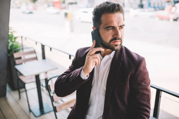 Ethnic Bearded Male Suit Answering Phone Call Looking Away Serious — Stock Photo, Image