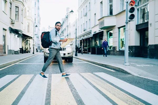 Side View Modern Traveling Guy Backpack Holding Paper Map Crossing — Stock Photo, Image