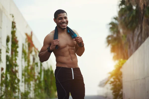 Portrait of attractive handsome man smiling looking satisfied with sport — Stock Photo, Image