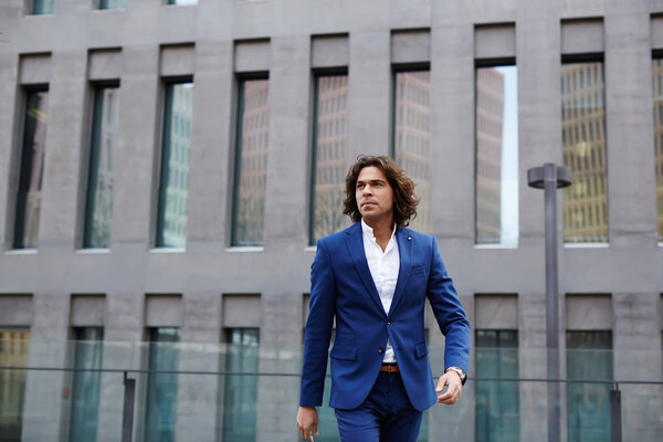 Handsome man walking in city