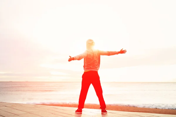 Sporty man with raised arms — Stock Photo, Image