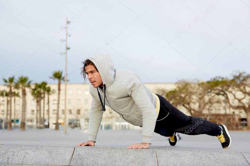 Handsome man doing push ups