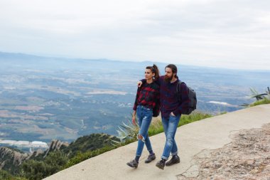 Holiday-maker husband and wife are happy with a stroll in its output